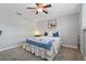 Comfortable bedroom with stylish decor, ceiling fan, and neutral walls at 7909 Canna Dr, Port Richey, FL 34668