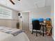 Bedroom with desk, workspace and natural light at 7909 Canna Dr, Port Richey, FL 34668