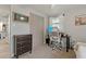 Bedroom with functional workspace and closet offering both comfort and practicality at 7909 Canna Dr, Port Richey, FL 34668