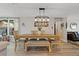 Cozy dining room featuring a wooden dining set with views into the living room at 7909 Canna Dr, Port Richey, FL 34668