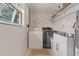 A charming laundry room equipped with modern washer, dryer, and ample storage at 7909 Canna Dr, Port Richey, FL 34668