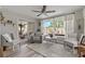 Inviting room features neutral tones, comfortable seating, and a view to the private outdoor pool at 7909 Canna Dr, Port Richey, FL 34668