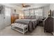 Cozy primary bedroom with a comfortable bed, natural light, and neutral decor at 7909 Canna Dr, Port Richey, FL 34668