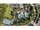 Aerial view of the community amenities featuring tennis courts, pool, playground and parking for a vibrant and active lifestyle at 8015 Hampton Glen Dr, Tampa, FL 33647