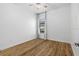 A bright bedroom features wood flooring, a window, and natural light at 8015 Hampton Glen Dr, Tampa, FL 33647