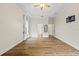 A spacious bedroom features wood flooring, a ceiling fan, and ample natural light at 8015 Hampton Glen Dr, Tampa, FL 33647