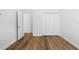 A bright bedroom features wood flooring and a closet at 8015 Hampton Glen Dr, Tampa, FL 33647
