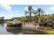Community entrance sign with lush greenery and a gazebo at 8015 Hampton Glen Dr, Tampa, FL 33647