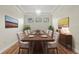 Formal dining room features wood flooring, a chandelier and multiple windows at 8015 Hampton Glen Dr, Tampa, FL 33647