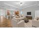 The living room features modern furnishings and an open layout to the kitchen area at 8015 Hampton Glen Dr, Tampa, FL 33647