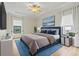 Serene main bedroom with neutral tones, tray ceiling, and abundant natural light at 8015 Hampton Glen Dr, Tampa, FL 33647