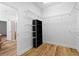 A walk-in closet features custom shelving and wood flooring at 8015 Hampton Glen Dr, Tampa, FL 33647