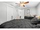 Cozy bedroom boasts an open door to a walk-in closet, providing ample storage space at 9126 Greenbriar Ln, Port Richey, FL 34668