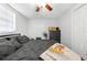 Well-lit bedroom includes a ceiling fan, large window, and a spacious closet for optimal comfort at 9126 Greenbriar Ln, Port Richey, FL 34668
