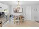 Dining room with tile flooring, a rustic wood table, and direct access to other living spaces at 9126 Greenbriar Ln, Port Richey, FL 34668