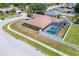 Aerial view of home with fenced backyard and screened pool at 10149 Briar Cir, Hudson, FL 34667
