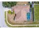 Aerial view of home with fenced backyard and screened pool at 10149 Briar Cir, Hudson, FL 34667
