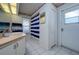 Bathroom featuring a single vanity and a walk-in shower at 10149 Briar Cir, Hudson, FL 34667
