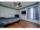 Bedroom featuring wood-look flooring, ceiling fan, and window at 10149 Briar Cir, Hudson, FL 34667