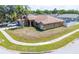 Spacious single-story home with attached garage, surrounded by a well-maintained lawn and trees at 10149 Briar Cir, Hudson, FL 34667