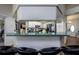 Kitchen bar with stylish stools and unique countertop at 10149 Briar Cir, Hudson, FL 34667