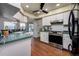 Kitchen with tile floors, stainless steel appliances and access to the outdoor pool at 10149 Briar Cir, Hudson, FL 34667