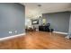 Open concept living space featuring stylish wood-look flooring, dining area, and modern decor at 10149 Briar Cir, Hudson, FL 34667