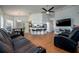 Open-concept living room features tile floors, vaulted ceilings, kitchen bar and comfortable seating at 10149 Briar Cir, Hudson, FL 34667