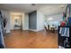 Open concept living and dining area featuring wood-look tile flooring and a modern aesthetic at 10149 Briar Cir, Hudson, FL 34667