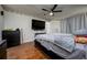 Large bed in this spacious main bedroom with ceiling fan at 10149 Briar Cir, Hudson, FL 34667