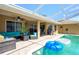 Relaxing covered pool with patio furniture and floats at 10149 Briar Cir, Hudson, FL 34667