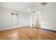 View of the bedroom featuring shuttered windows, ceiling fan, and laminate wood floors at 1021 15Th St, Palm Harbor, FL 34683