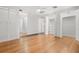 Bedroom featuring hardwood floors, ceiling fan and multiple closets at 1021 15Th St, Palm Harbor, FL 34683