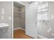 Spacious closet with shelving, wood flooring and door that leads out to the hall and natural light at 1021 15Th St, Palm Harbor, FL 34683