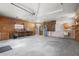 Unfinished Garage with work benches, a sink, water heater, and plenty of open space for parking at 1021 15Th St, Palm Harbor, FL 34683