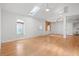 Bright living room featuring hardwood floors, white walls, skylights, and large windows at 1021 15Th St, Palm Harbor, FL 34683