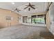 View of a spacious patio, with screened windows, and ceiling fans at 1021 15Th St, Palm Harbor, FL 34683