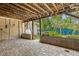 Covered outdoor patio area with brick flooring, wood ceiling and a view of the lush backyard at 1021 15Th St, Palm Harbor, FL 34683