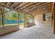 Large outdoor patio area with brick pavers, and a wood slat ceiling at 1021 15Th St, Palm Harbor, FL 34683
