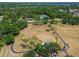 Expansive aerial view of the neighborhood park featuring walking trails, playgrounds, and open green spaces surrounded by mature trees at 10408 Butia Pl, Tampa, FL 33618