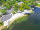 Aerial view of the lakefront showing parking, beach, covered area, and boat launch at 10408 Butia Pl, Tampa, FL 33618