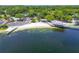 Aerial view of the lakefront area, featuring a beach and boat launch at 10408 Butia Pl, Tampa, FL 33618