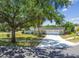 A well-maintained single-story home with a two-car garage, beautiful landscaping and a large driveway at 10408 Butia Pl, Tampa, FL 33618