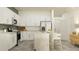 Modern kitchen featuring stainless appliances, white cabinets and eat in bar seating at 10804 Keato Beach Ct, Tampa, FL 33647