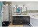 Modern bathroom featuring dual sinks, a walk-in shower, and a soaking tub at 11203 Killearn Ct, Riverview, FL 33569