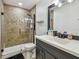 Bathroom featuring a glass shower with a unique tiled wall and a modern vanity sink at 11203 Killearn Ct, Riverview, FL 33569