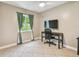 Bedroom with desk and large window at 11203 Killearn Ct, Riverview, FL 33569