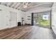 Bonus room featuring new floors, bright lighting, and a ceiling fan with backyard access at 11203 Killearn Ct, Riverview, FL 33569