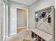 Inviting entryway with coat rack, shoe storage, and neutral color palette at 11203 Killearn Ct, Riverview, FL 33569