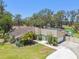 Beautiful home with mature trees, landscaping, and a large driveway for easy access at 11203 Killearn Ct, Riverview, FL 33569